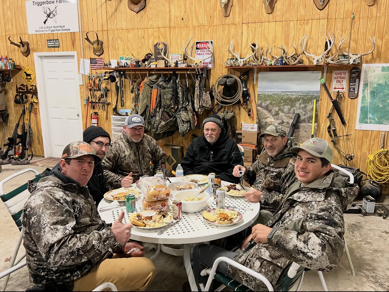 The crew around the table in the barn.