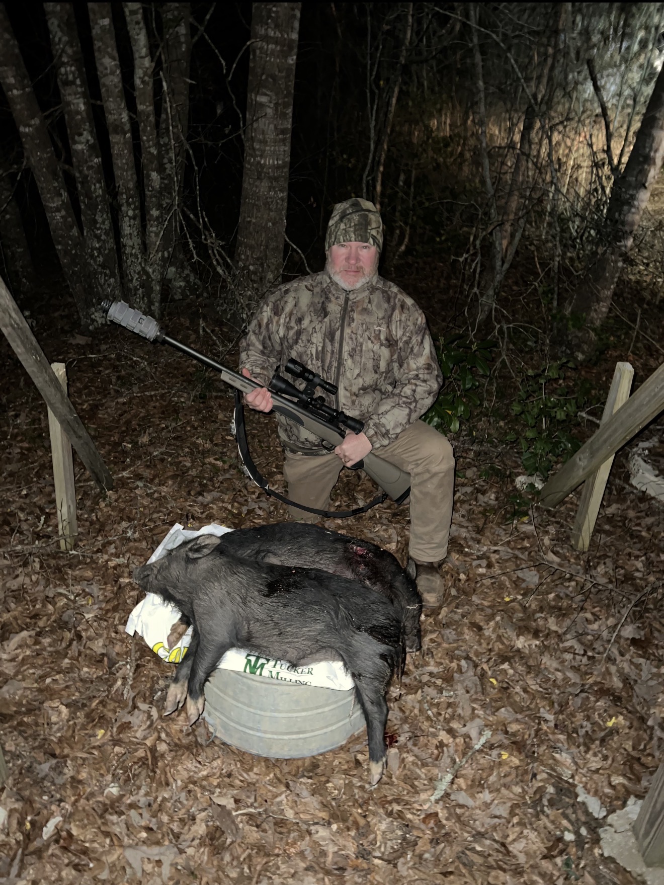 Suppressed .308 with cyclops laser — two hogs down.