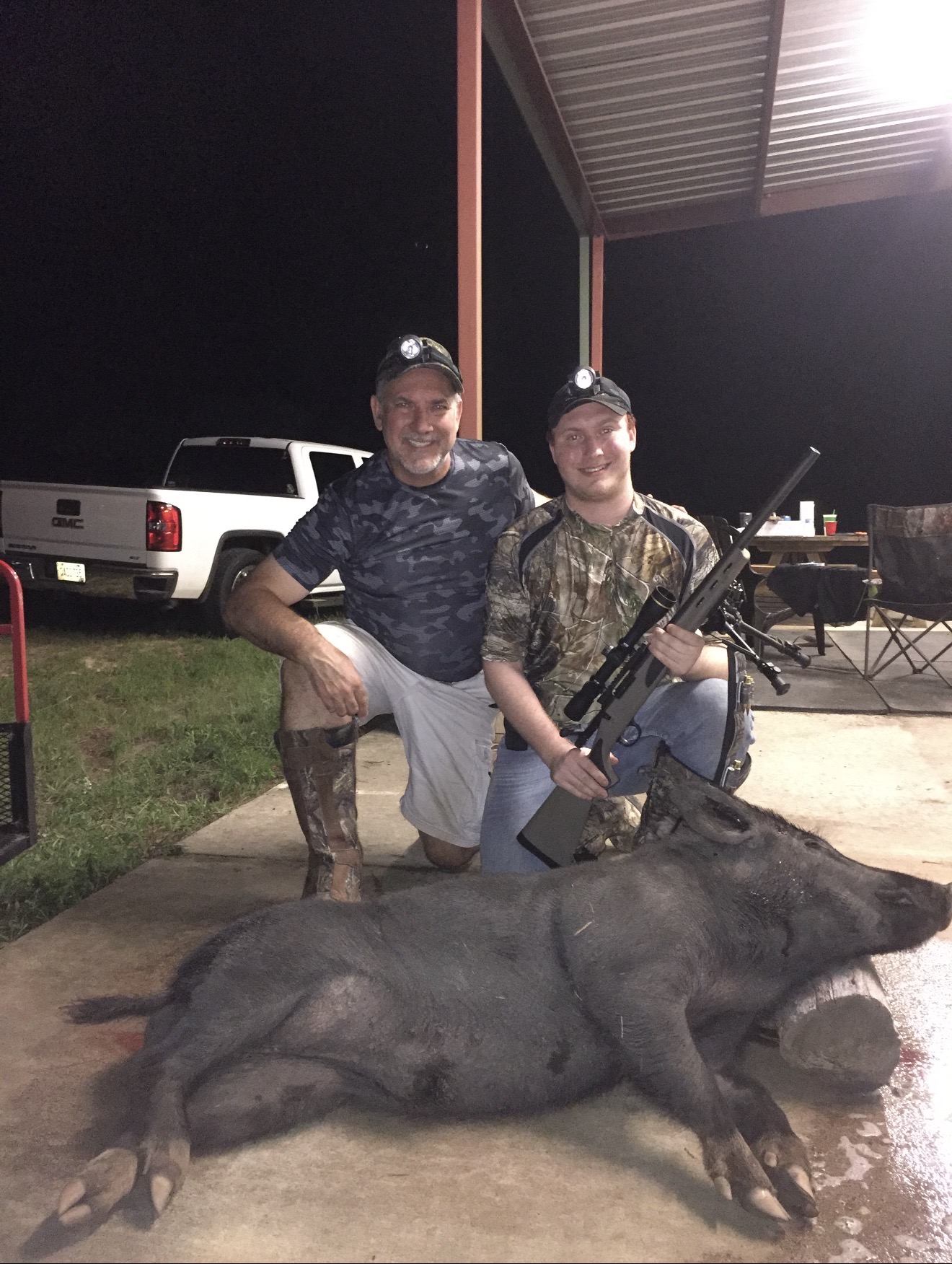JB and Jake Barber with the first boar taken at Trigger Bow Ga — a 260 lb Black Russian monster.