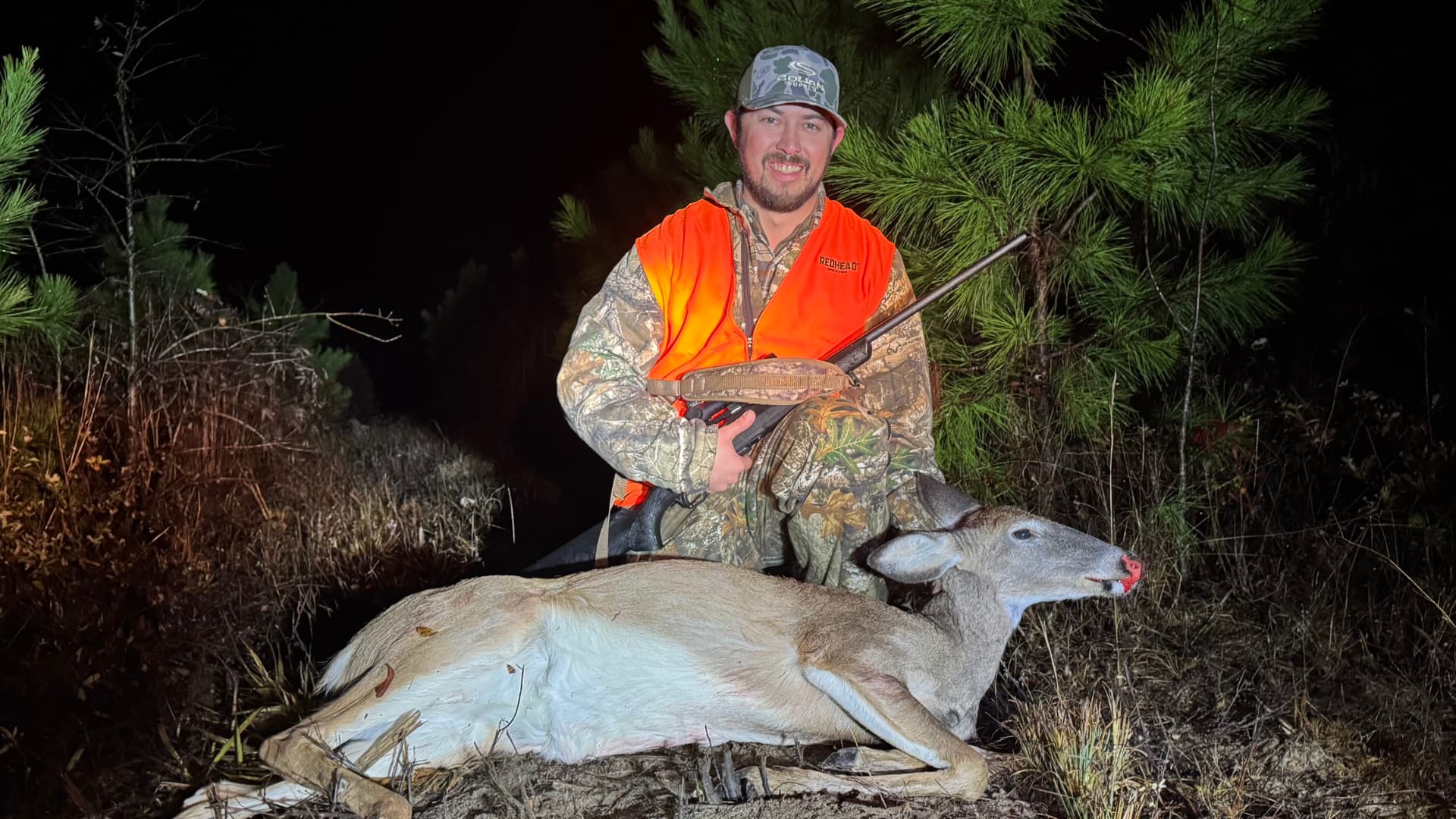 Thomas with his first deer — a big management doe.