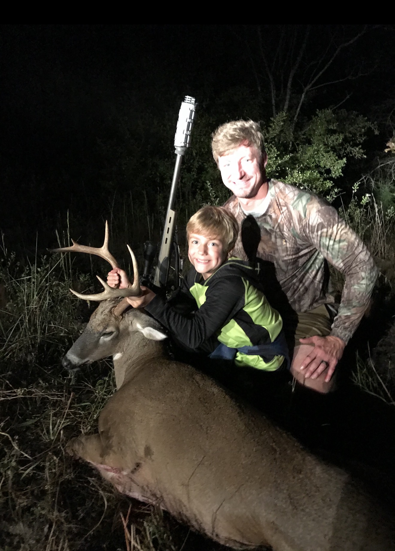 8 year old with his first buck ever taken at Triggerbow.