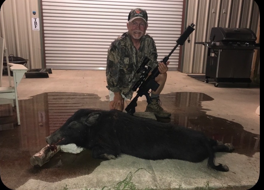 Rudy with a TBF hog. Farm 308 AR10 suppressed.