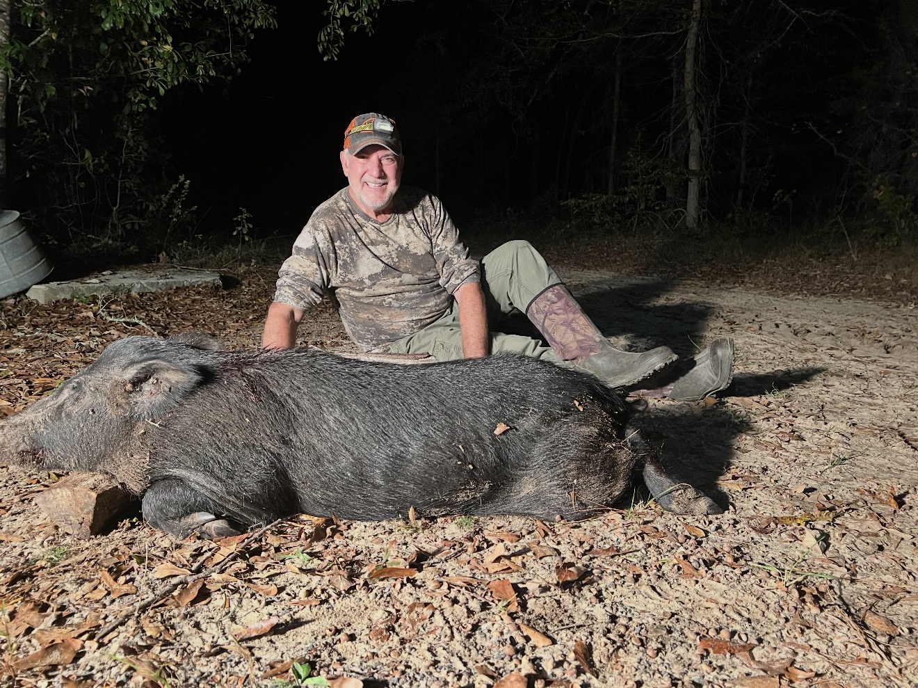 JB with a large Russian boar that made a mistake at the powerline feeder.